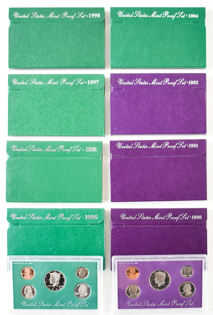 1990s UNITED STATES PROOF SETS: An assortment of eight U.S. proof sets from the years 1990-1992 and 1994-1998. Each set comes in a hard plastic case and paper case measuring 3.5" H x 5.5" W x 0.5" D.