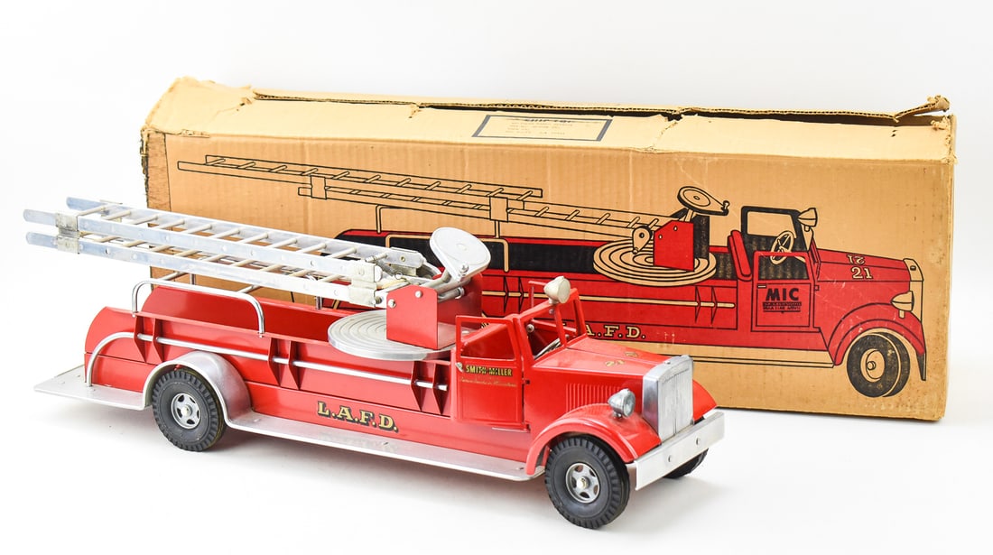 SMITH MILLER - IRONSON PRESSED STEEL 'AERIAL LADDER FIRE TRUCK' No. 537 W/ORIGINAL BOX: A Smith Miller - Ironson Corporation pressed steel "Aerial Ladder Fire Truck" No. 537 with original box, circa 1950s. The item measures 9" H, 28" W, 7" D.