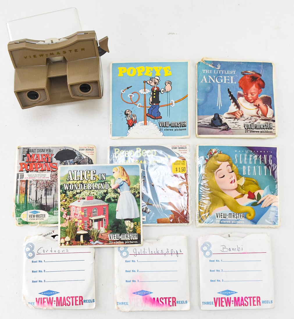 SAWYERS VIEW-MASTER W/ OVER 30 SLIDE REELS FROM DISNEY, WARNER-BROS, HANNA-BARBERA: A Sawyer's View-Master, circa late 1960s, and approximately 34 slide reels from Disney, Warner-Bros, Hana-Barbera and other producers. Some slides include Popeye, Alice in Wonderland, Mary Poppins, Sl