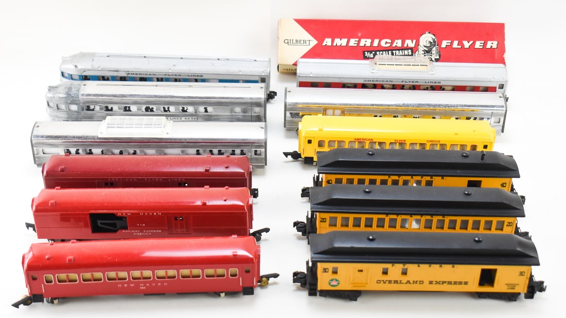 9 PASSENGER CARS FROM AMERICAN FLYERS: This lot includes 9 traditional passenger cars from the American Flyer Lines and 3 from the Franklin Set. Cars from the Franklin Set are metal, while the rest are plastic. Half of the lot has link cou