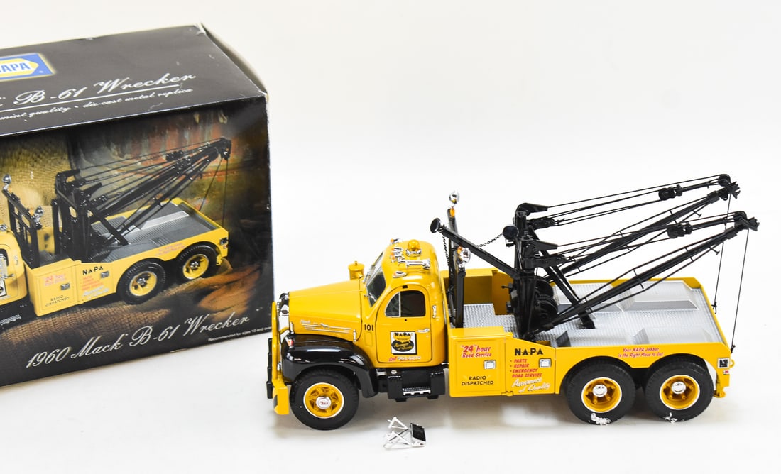 NAPA 1960 MACK B-61 WRECKER DIE-CAST: A Napa 1960 Mack B-61 Wrecker metal die-cast 1:25 scale model in the original box. The box measures 7" H x 14.5" W x 6" D.