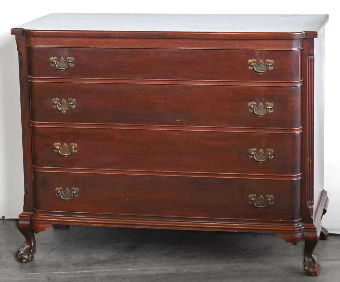 JOHN A. COLBY & SONS MAHOGANY DRESSER: A John A. Colby & Sons - The Georgetown Galleries mahogany chest of drawers with four drawers on claw and ball feet, dated 1945. The item measures 37" H, 46" W, 21.5" D.