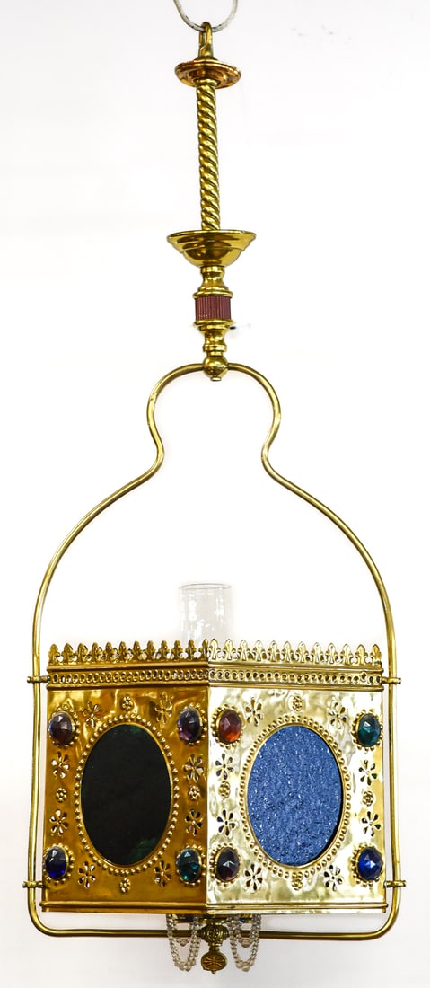 VICTORIAN JEWELED HALL LANTERN: A Victorian jeweled hanging hall lantern with vibrant blue, red, green, and purple stained glass panels, circa late 19th century. The lamp has a central oil lamp with a hurricane glass shade. The lamp