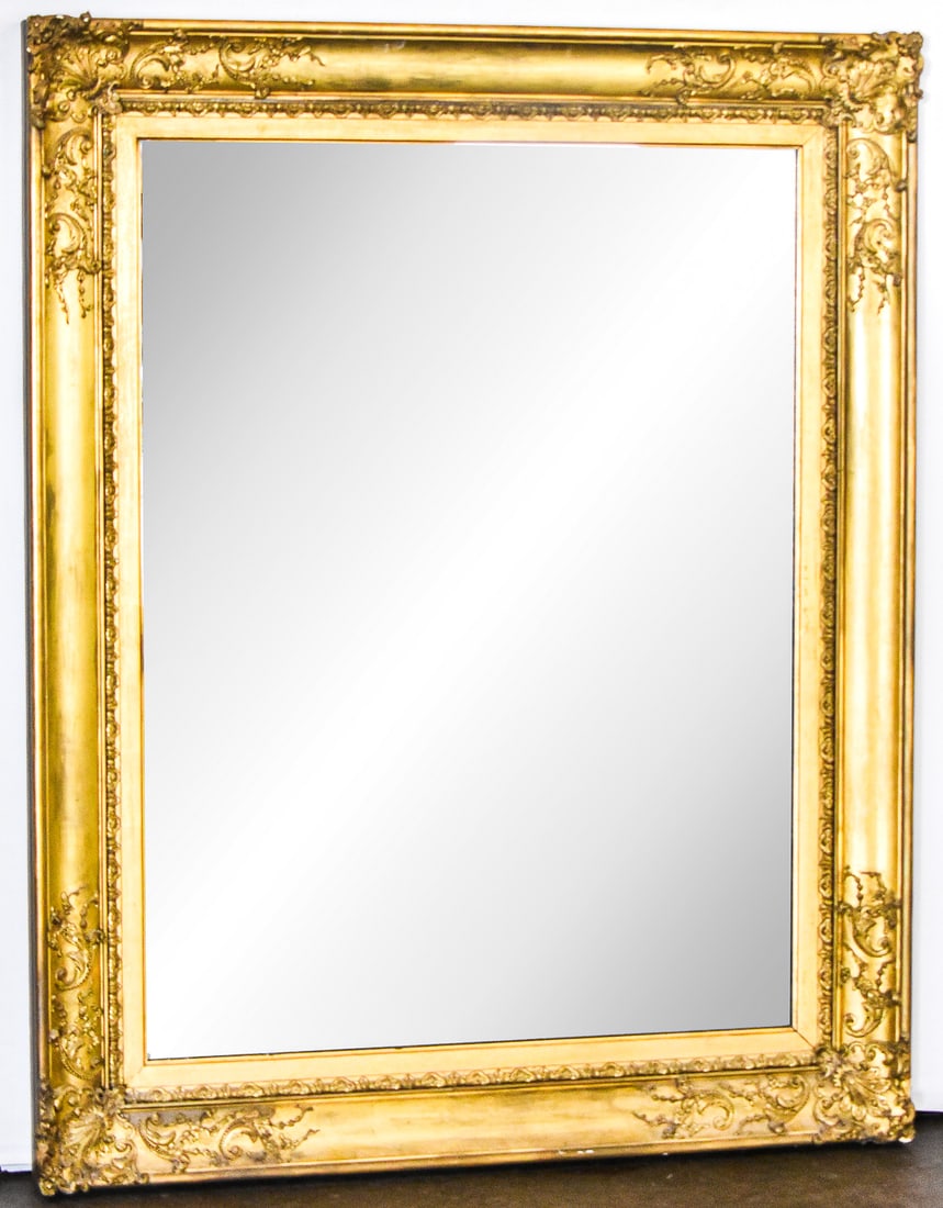 ITALIANATE GILT MIRROR: An Italianate gilt mirror, circa late 19th - early 20th century. The item measures 50" H, 39.5" W, 3.5" D.