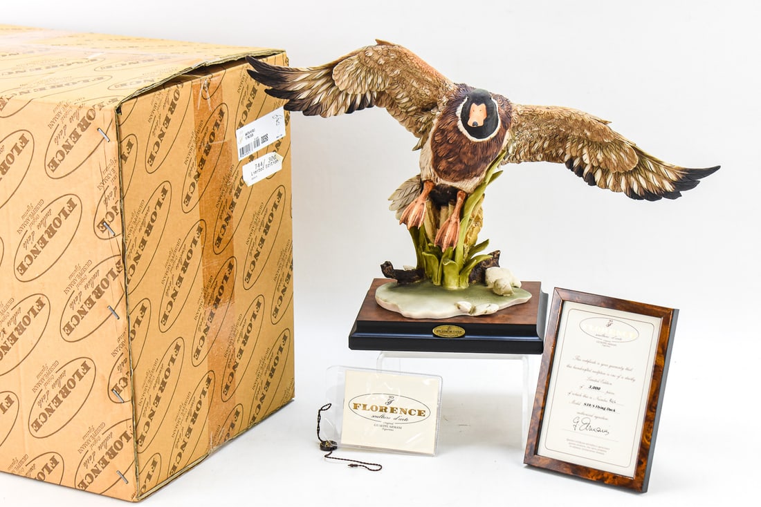 GIUSEPPE ARMANI/CAPODIMONTE "FLYING DUCK": A 1991 signed Giuseppe Armani (listed Italian artist; 1936-2006) and Capodimonte for Florence Sculture d'Arte "Flying Duck" limited edition No. 744 of 3000 sculptural figurine with an original box.