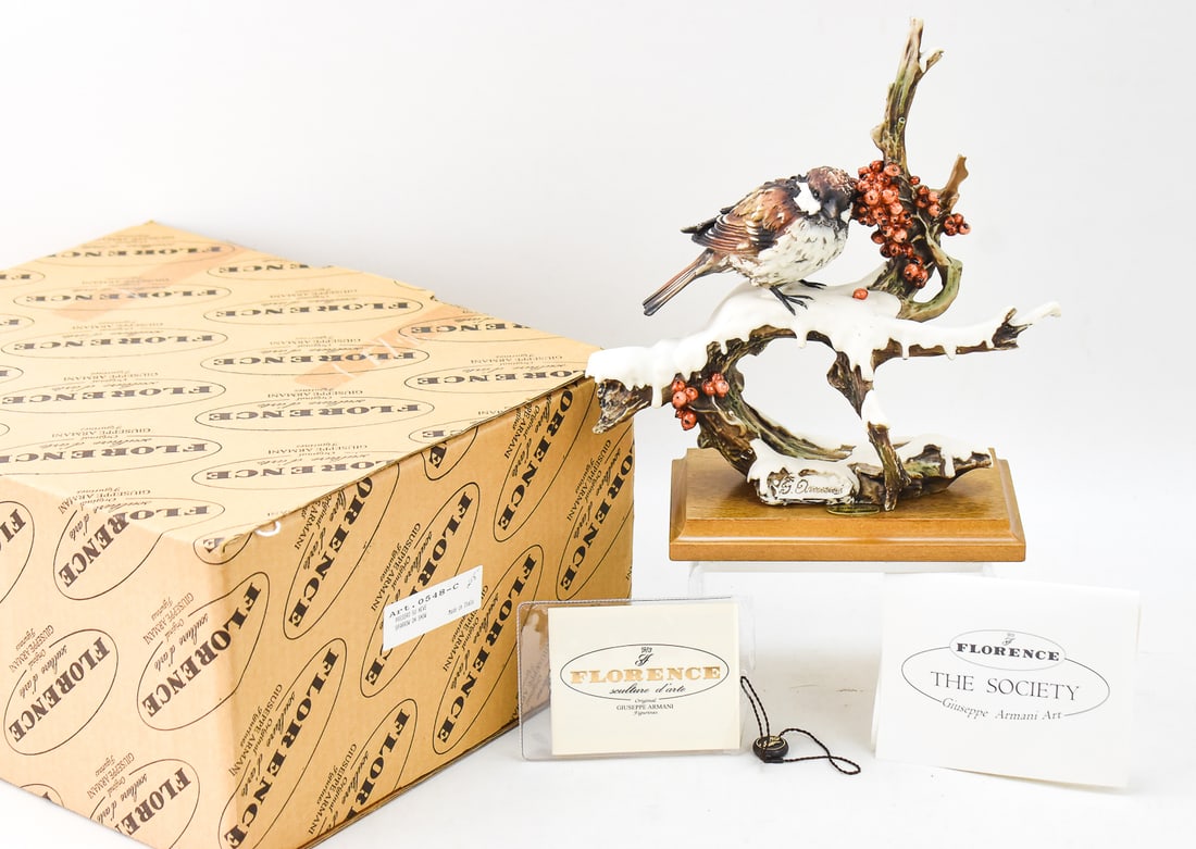 GIUSEPPE ARMANI/CAPODIMONTE "PASSERO SU NEVE (SPARROW ON SNOW)": A 1982 signed Giuseppe Armani (listed Italian artist; 1936-2006) and Capodimonte for Florence Sculture d'Arte "Passero su Neve (Sparrow on Snow)" sculptural figurine with an original box. The item