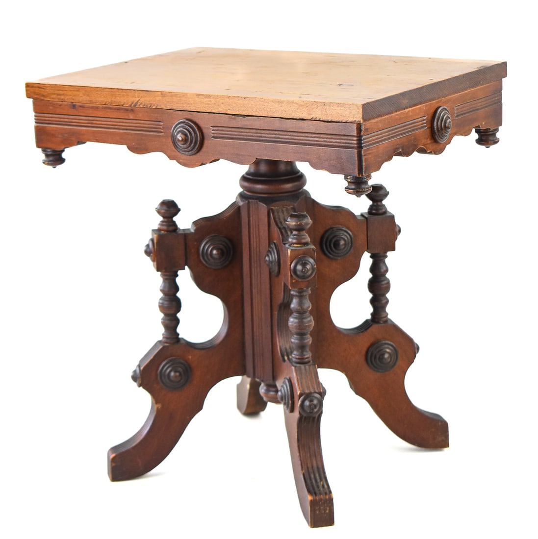 VICTORIAN EASTLAKE LOW PLANT STAND: A Victorian Eastlake low plant stand, circa late 19th century. The metal insert is marked by The Charles Parker Company of Meriden, Connecticut. The item measures 18.5" H, 17.5" W, 13.5" D.