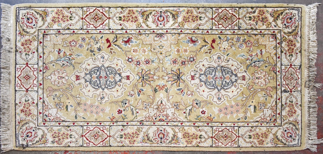 PESHAWAR CHOBI WOOL RUG: A Peshawar Chobi wool rug with floral designs and natural vegetable dye colors. The rug measures 52" L x 24.5" W.