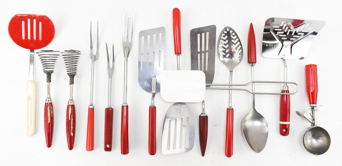 ASSORTMENT OF VINTAGE KITCHEN UTENSILS: An assortment of vintage kitchen utensils including spatulas, whisks, serving spoons, serving forks, and an ice cream scoop made by multiple makers including Bonny, Ekco A&J, Maid of Honor, Siegle