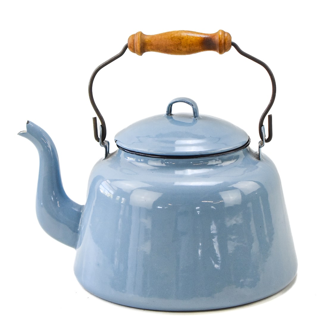 BLUE ENAMEL STOVETOP TEA KETTLE: A blue enameled stovetop tea kettle with a wooden handle, likely of European origin, circa late 20th century. The item measures approx. 8.5" H x 10" W x 13" D.