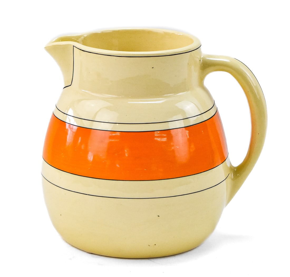 ROSEVILLE CREAMWARE PITCHER; EARLY 20TH CENTURY: A Roseville Creamware pitcher, circa 1920s-1940s. The item measures approx. 7.5" H x 8" W x 6.5" D.