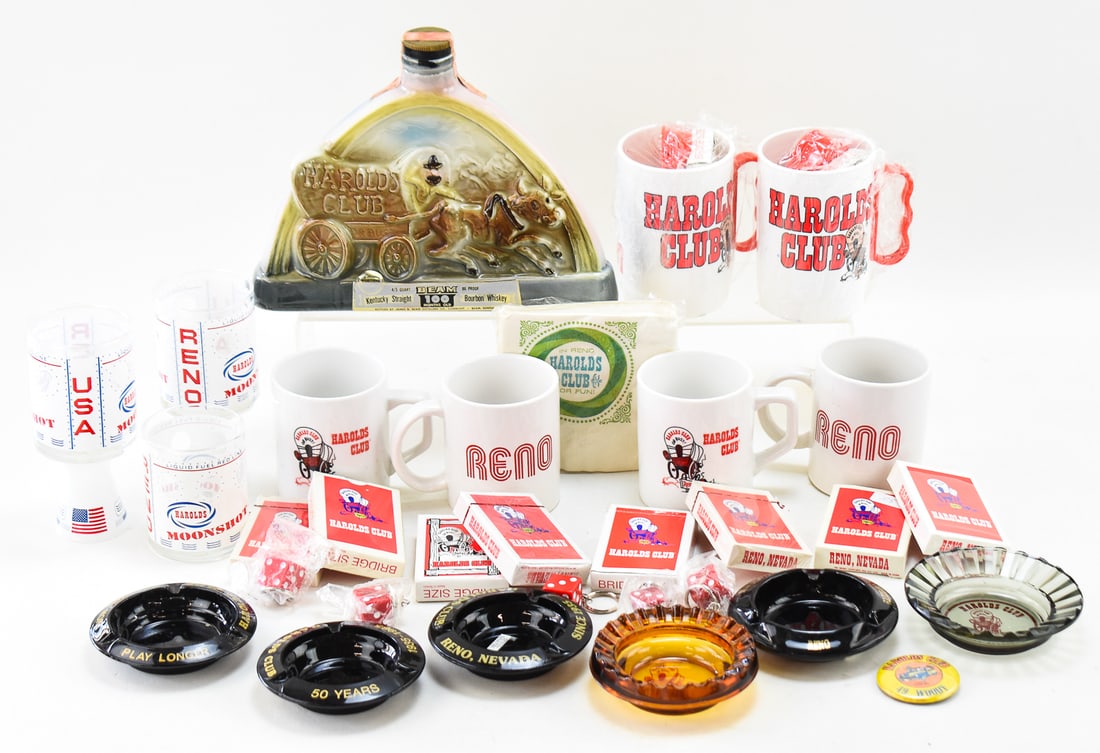 COLLECTION OF VINTAGE HAROLDS CLUB RENO NEVADA SOUVENIRS: A collection of 1960s-70s Harold's Club, Reno, Nevada, casino souvenirs which includes: dice keychains, opened and unopened decks of cards, glass tumblers, plastic mugs, napkins, ashtrays, and a decan