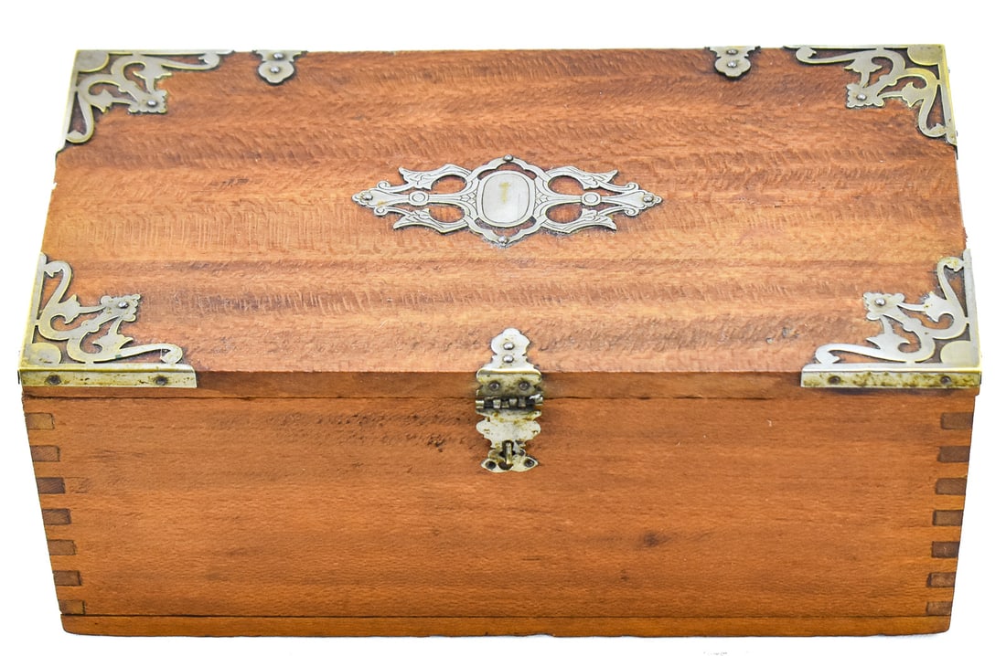 P. LORILLARD & COMPANY QUARTERSAWN OAK CIGAR BOX, C. LATE 19TH CENTURY: A decorative cigar box constructed of quartersawn oak with metal corner guards, cartouche, and a flip latch lock on the front, made for P. Lorillard & Company cigars, circa late 19th century. The 