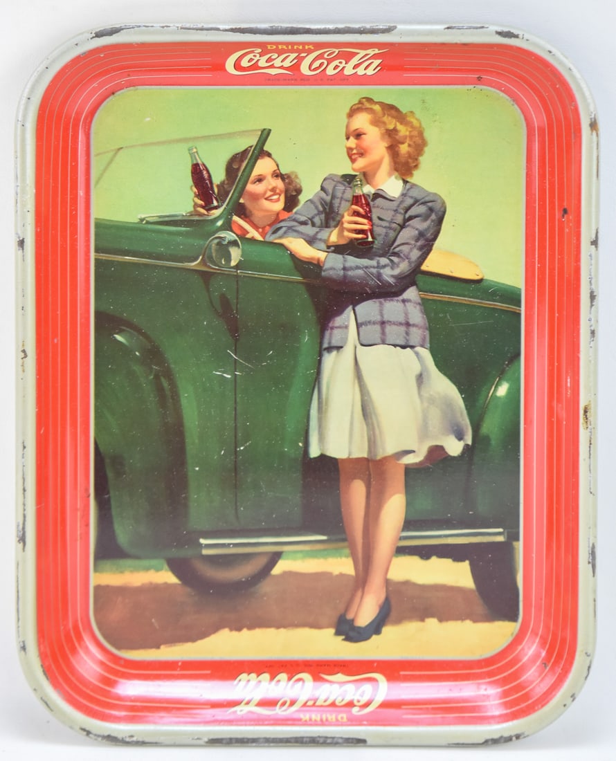 ORIGINAL 1942 COCA-COLA "ROADSTER GIRLS" METAL SERVING TRAY: A original circa 1942 Coca-Cola metal serving tray which measures approx. 13.5" H x 10.5" W x 1" D.