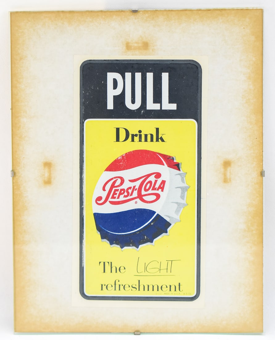 PESI-COLA "PULL" DOOR SIGN: The sign was manufactured by the Stout Sign Co circa 1950. The sign measures approx. 11" H x 8.5" W x 0.5" D.