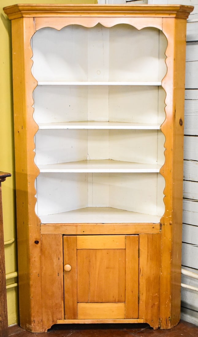 AMERICAN KNOTTY PINE CORNER CABINET: Corner cabinet is made of knotty pine circa the late 19th century. The shelves and interior have been painted. Cabinet measures approx. 78" H x 44" W x 18.5" D.