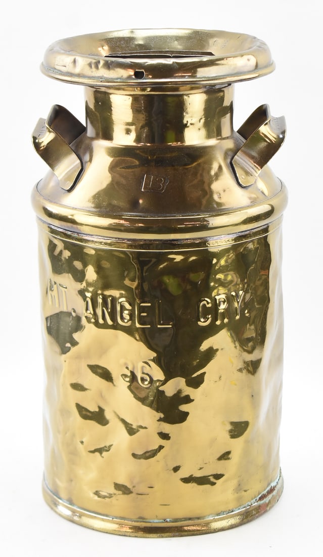 MT. ANGEL, OREGON HANDLED BRASS 36 OZ. MILK CAN: The Buhl Stamping Company handled brass 36 ounce milk can for Mt. Angel, Oregon, circa early 20th century. The item measures approx. 19.5" H x 10" W x 10" D.