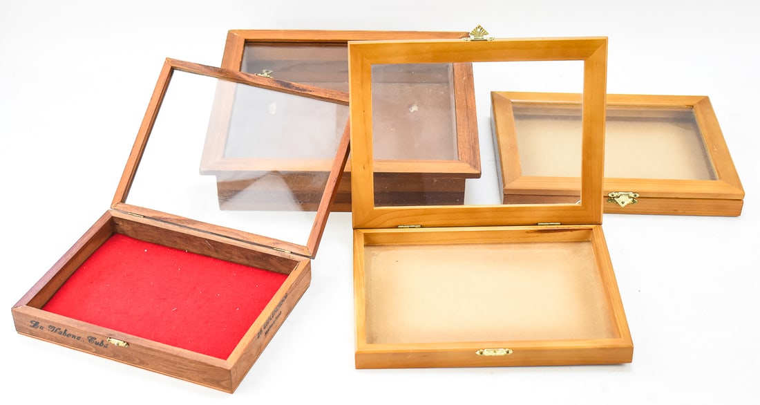SET OF FOUR WOOD & GLASS DISPLAY CASES: Two matching and two unique display boxes for wall hanging. One is an old Habanos S.A. cigar box made in Cuba while the rest are unmarked. The largest box measures approx. 13" H x 13" W x 3" D.