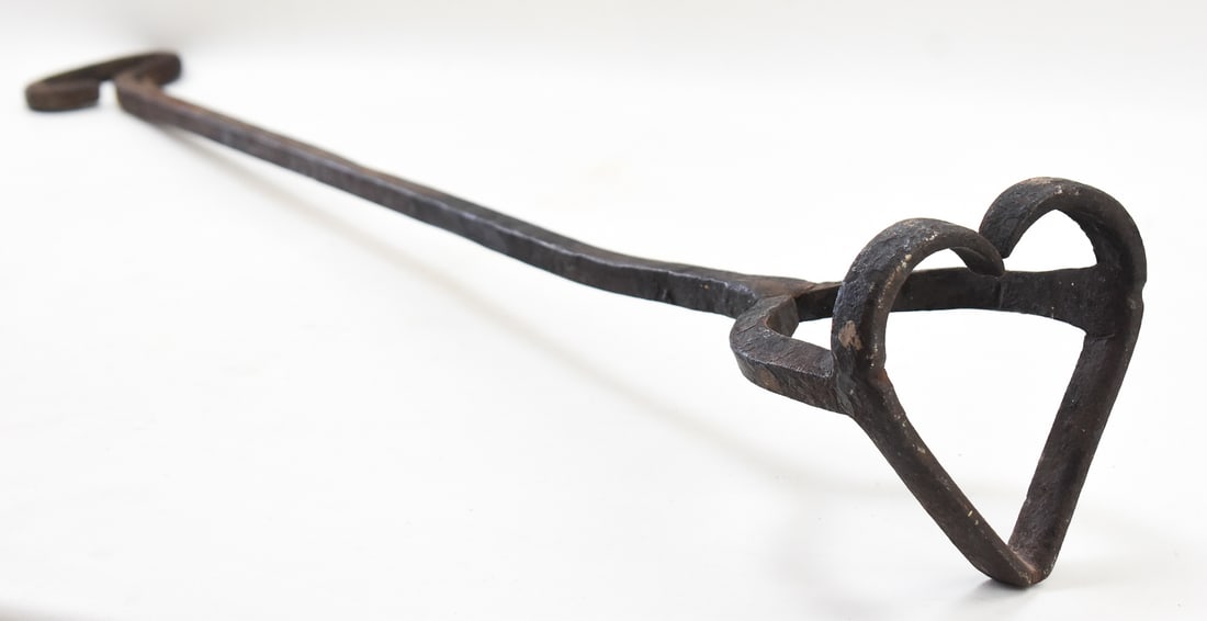 FORGED IRON HEART-SHAPED BRANDING IRON, C. LATE 19TH/EARLY 20TH CENTURY: A hand-forged iron heart-shaped branding iron, made circa late 19th/early 20th century. This brand comes from Eastern Oregon, but the exact origins are unknown. The branding iron measures approx. 41"