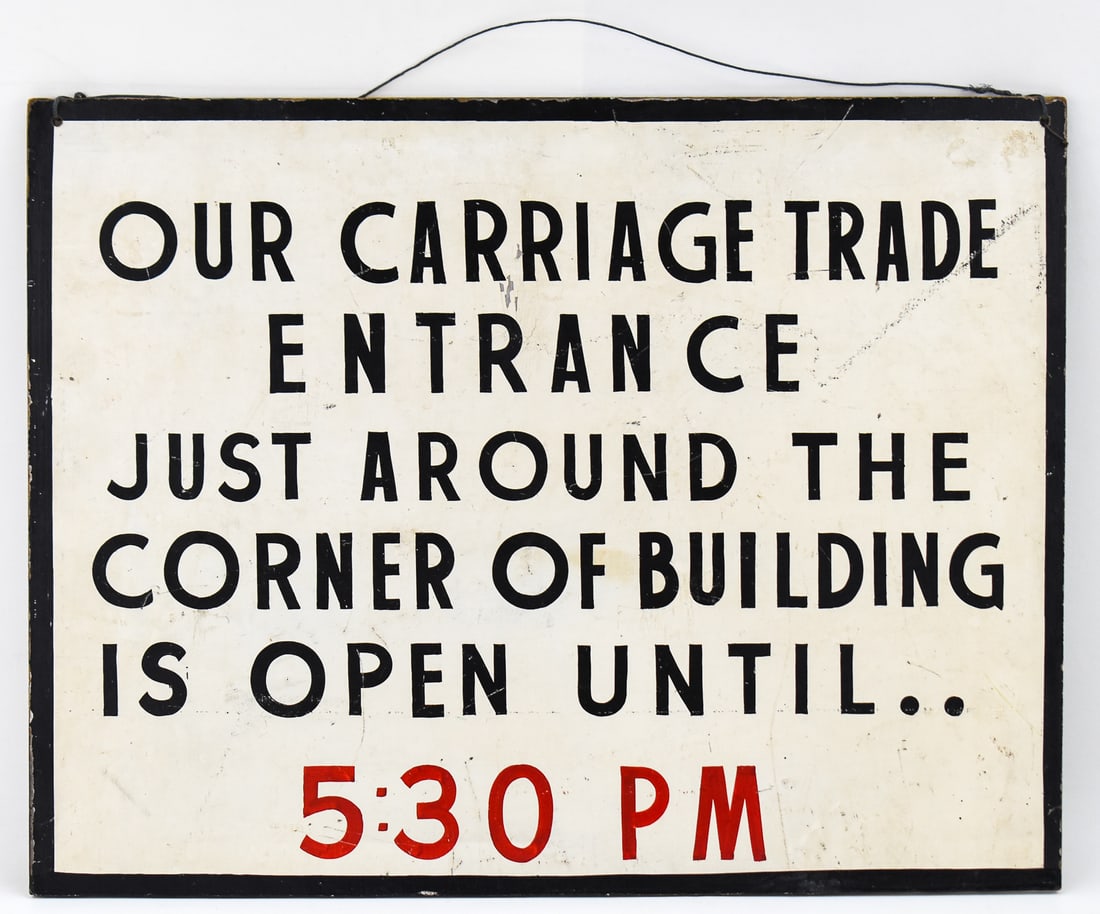 "CARRIAGE TRADE ENTRANCE" SIGN: The sign is made of a thin, dense wood with painted on letters on the front circa early mid to late 19th century. The sign measures approx. 18.5" H x 24" W x 0.5" D. Historically,