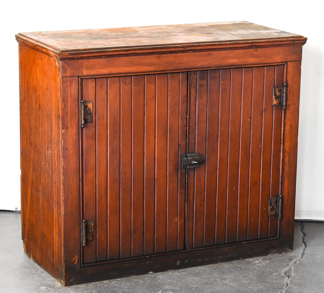 MID 19TH CENTURY WAINSCOTED FIR CABINET: This fir cabinet features a wainscoting design on the doors and backside and has one inner shelf. It measures approx. 30" H x 35" W x 16" D.