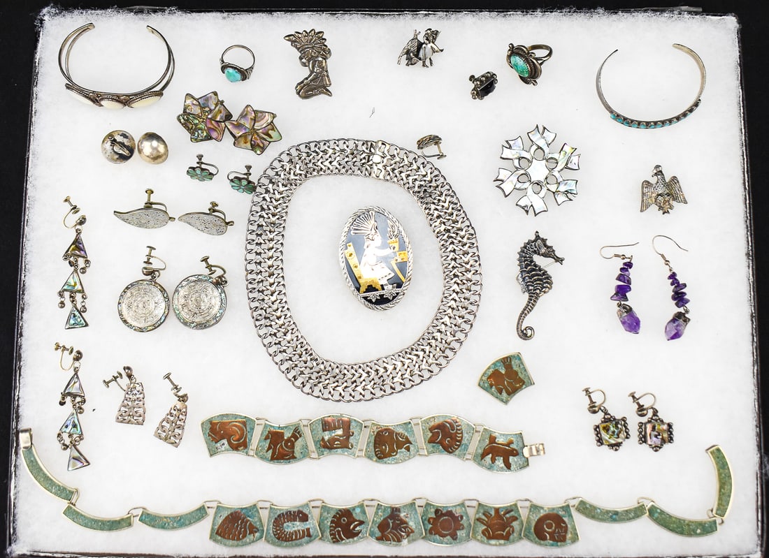 STERLING SILVER JEWLERY LOT: This lot consists of 20+ pieces of sterling silver jewelry. Most are stamped with "Mexico Sterling". There are 9 pairs of earrings, 4 half pairs of earrings, 3 pins, 3 bracelets, 2 necklaces, 2 rings