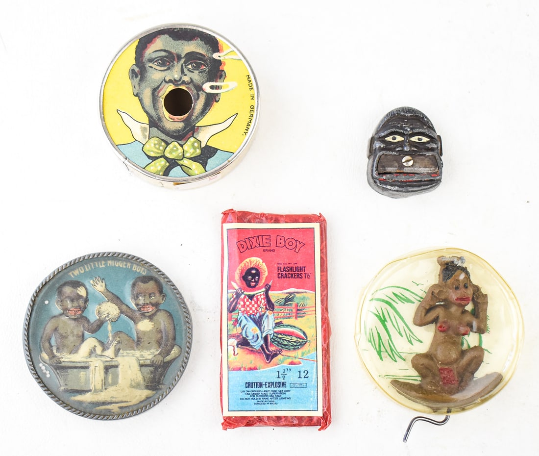 BLACK AMERICANA NOVELTY TOY COLLECTION: This collection consists of 5 novelty toys all circa 1910s-1930s. Toy one is a dexterity puzzle of children in the bathtub from Germany. Toy two is a novelty smoke ring blower from Germany. Toy three