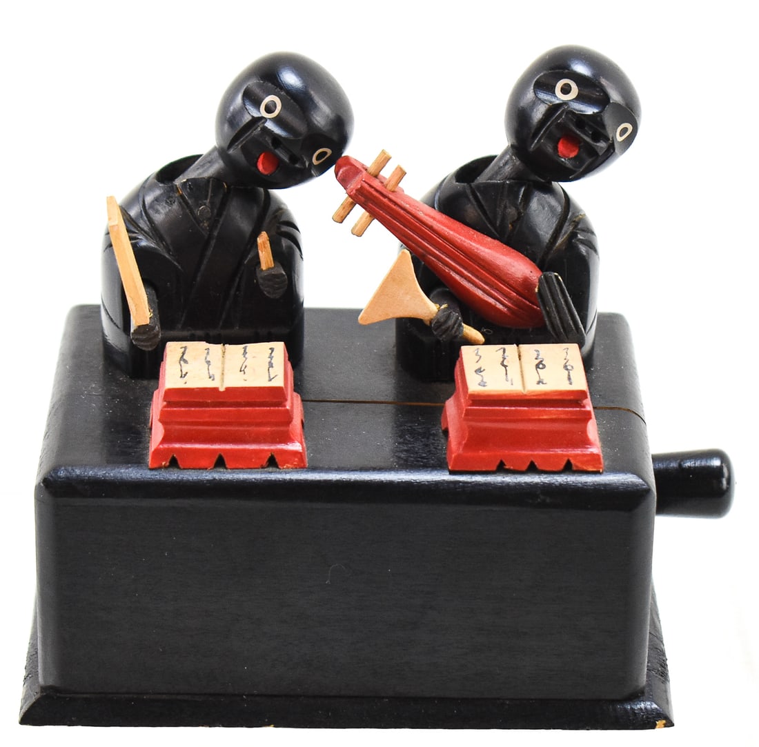 JAPANESE DOUBLE KOBE AUTOMATON TOY, C. EARLY 20TH CENTURY: A double Kobe wooden automaton toy or karakuri, made in Japan circa early-20th century. The Kobe toy features a shamisen player and a block paddler (mokugyo) who have moving arms using the wooden