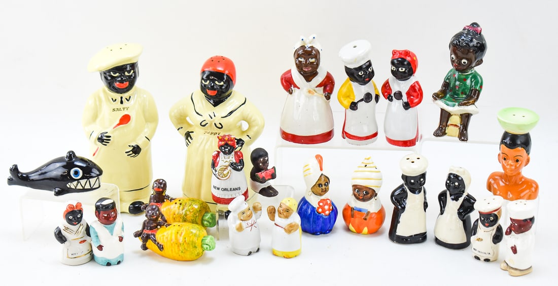 LARGE ASSORTMENT OF BLACK AMERICANA CERAMIC SALT AND PEPPER SHAKERS: A large assortment of 22 primarily Black Americana ceramic salt and pepper shakers, including a pair of large "Salty" and "Peppy" shakers, a variety of Japanese Black Americana shakers, a vintage