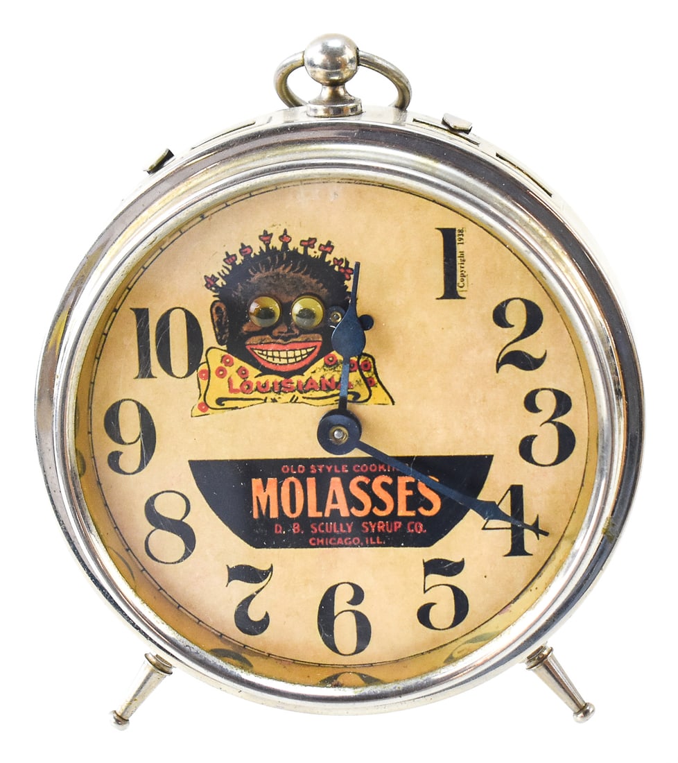 "OLD STYLE COOKING MOLASSES" BLACK AMERICANA ADVERTISING CLOCK, C. 1938: An "Old Style Cooking Molasses" Black Americana advertising clock for D.B. Scully Syrup Company of Chicago, Illinois, made circa 1938. The clock features the advertising character "Lousiana". One of t