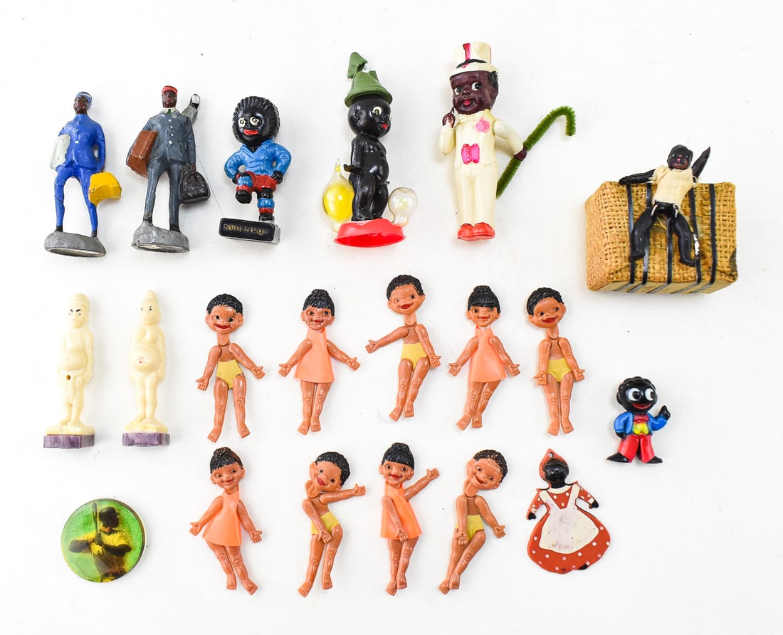 ASSORTMENT OF BLACK AMERICANA PLASTIC DOLLS & FIGURINES: An assortment of Black Americana plastic dolls and figurines including a vintage Black Baby "Wee-Wee" doll, a Ken Griffey Jr. picture disc, a Japanese bale of cotton from the South with a black doll a