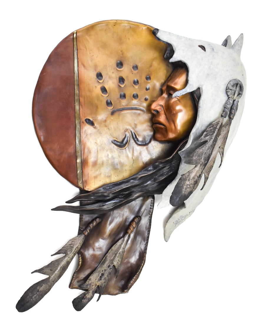 JIM JACKSON, BRONZE SCULPTURE OF NATIVE MAN IN WOLF HIDE HOOD: This original bronze sculpture by listed artist Jim Jackson (Born in Klamath Falls, Oregon, 1963-2018) features a Native American bust in a wolf hide hood on a dreamcatcher-like sculpture with a