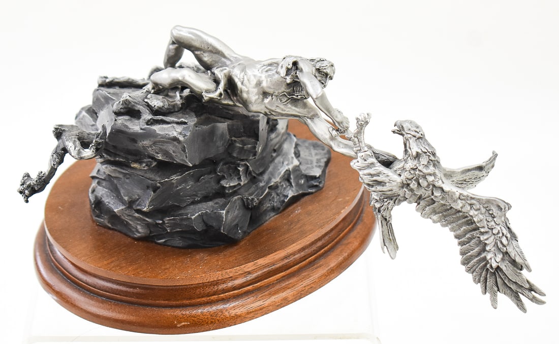 "EAGLE CATCHER" BY MICHAEL BOYETT FOR CHILMARK: A limited edition pewter sculpture titled "Eagle Catcher" created by artist Michael Boyett for Chilmark. This was a limited run of 2,500 pieces in 1982. The figure measures approx. 4" H