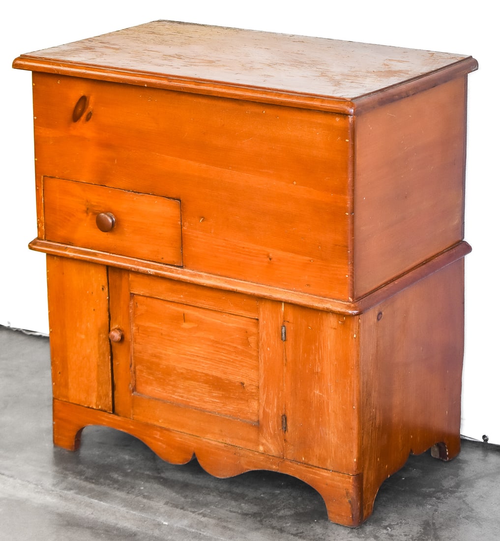 PINE DRY SINK, C. 19TH CENTURY: A primitive pine dry sink, made circa 19th century. The dry sink features a lift-top lid and a lower storage cabinet. The dry sink measures approx. 30" H x 28.5" W x 17.5" D.