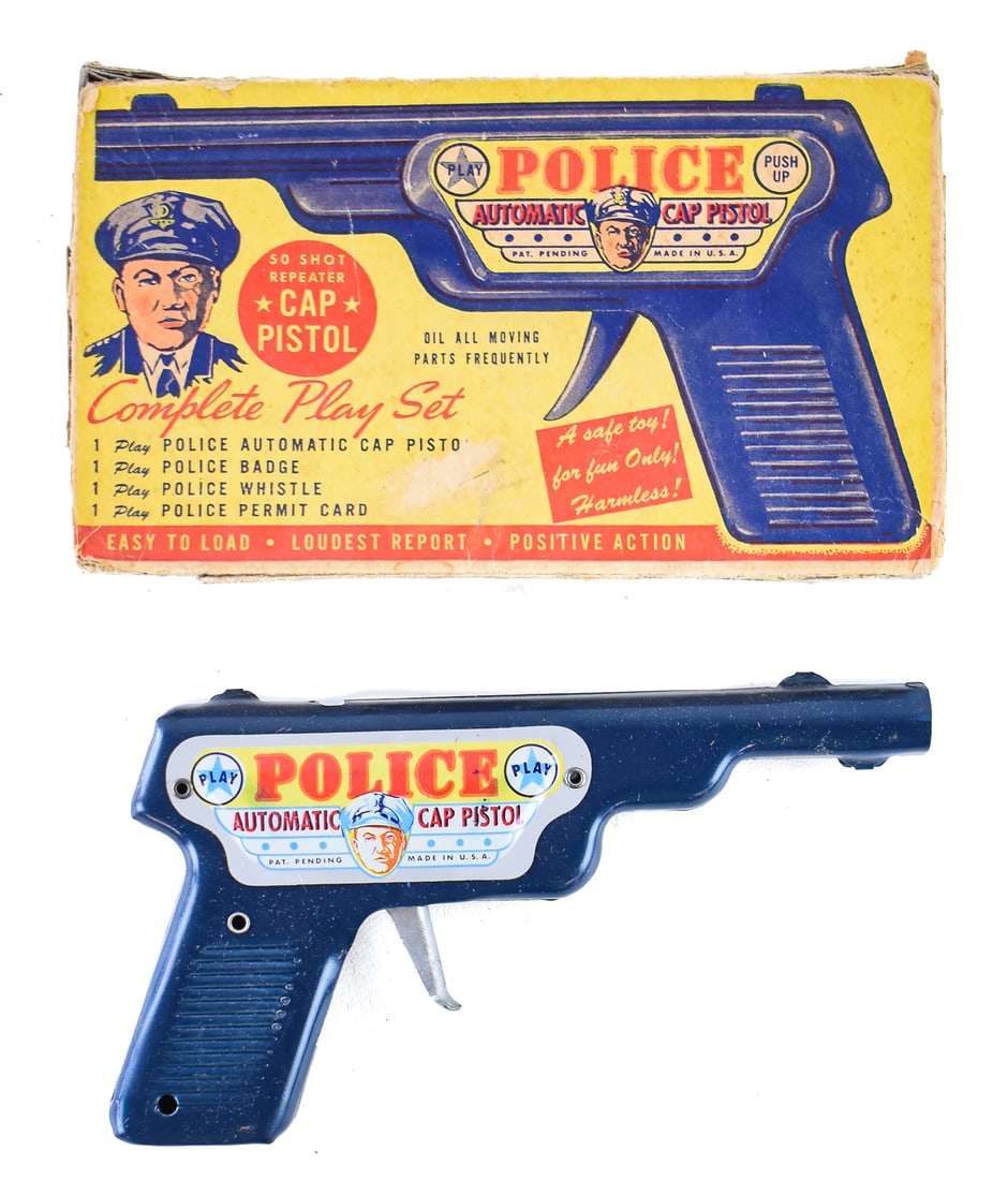PLAY POLICE AUTOMATIC CAP PISTOL: This lot only includes the pistol and the original box. The 50 shot repeater toy was manufactured by Meldon Brothers in 1948. The box measures approx. 5" H x 8" W x 1" D. Meldon