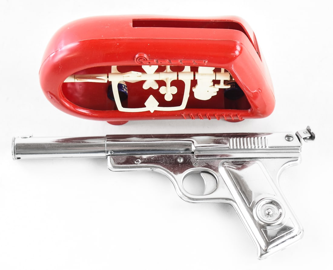 DAISY NO. 118 TARGETEER: This lot includes a nickel plated shooter and a red plastic targette shooting gallery. Also comes with its original .118 shots. This toy was only manufactured between 1949-1952. When assembled the