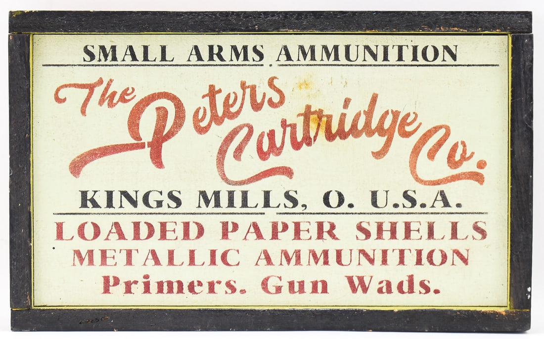 PAINTED WOOD ADVERTISING SIGN, THE PETERS CARTRIDGE CO., KINGS MILLS, OHIO: A contemporary wood painted advertising sign for The Peters Cartridge Company of Kings Mills, Ohio. The sign measures approx. 13.5" H x 21.5" W x 1.5" D.