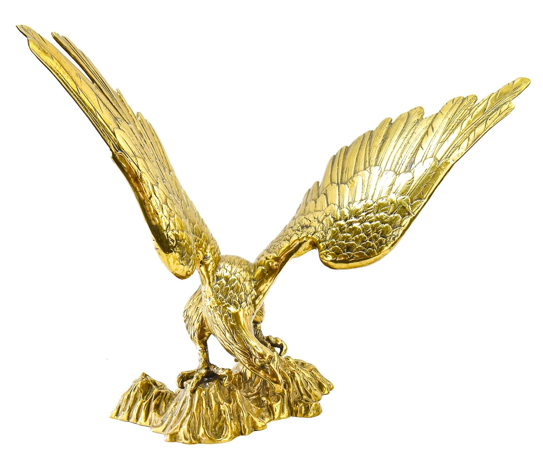 SOLID BRASS EAGLE STATUE: A solid brass eagle statue from the mid 20th century. The eagle measures approx. 23" H x 29" W x 13" D.