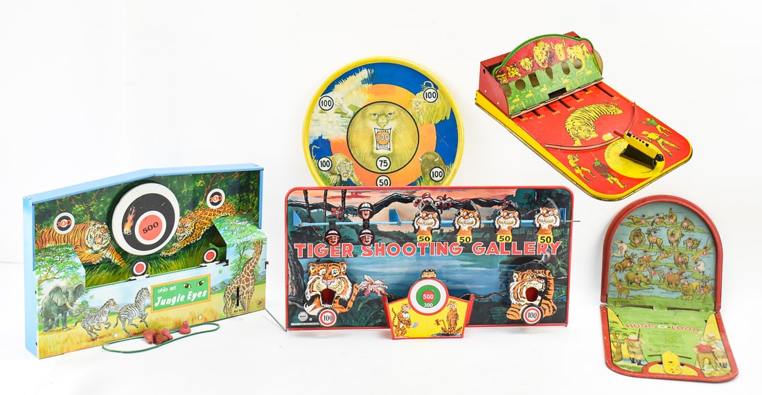 SAFARI THEMED SHOOTING GALLERIES COLLECTION: This collection consists of 5 different safari themed shooting galleries from the 1930s-1950s. Shooting gallery one is a tin litho game from Wolverine Supply & Manufacturing Co. with its attached
