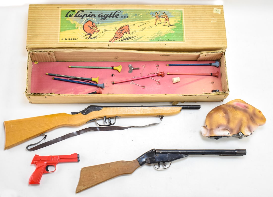 LE LAPIN AGILE GAME: Translated "The Agile Rabbit" is a French spring loaded target game. Manufactured by J.A. Paris in the 1940's. The box measures approx. 7" H x 27.5" W x 4" D.