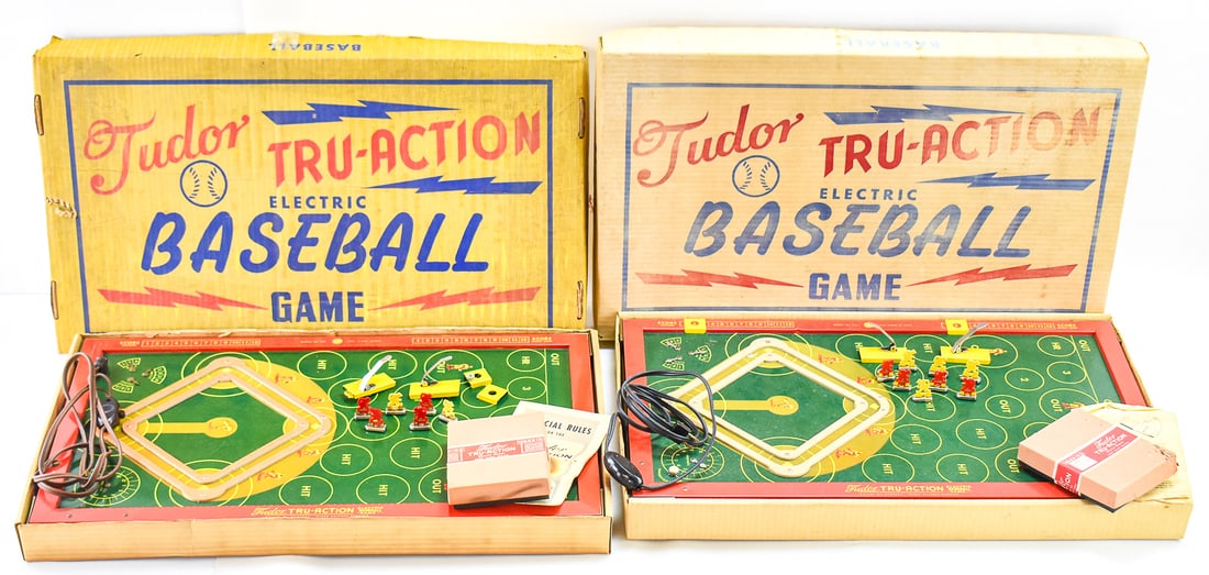 TUDOR TRU-ACTION ELECTRIC BASEBALL GAMES: There are two of these 1950's sports game boards in their original packaging. These games are a 2 player board game powered by a motor that makes the game field vibrate. Each game measures approx.