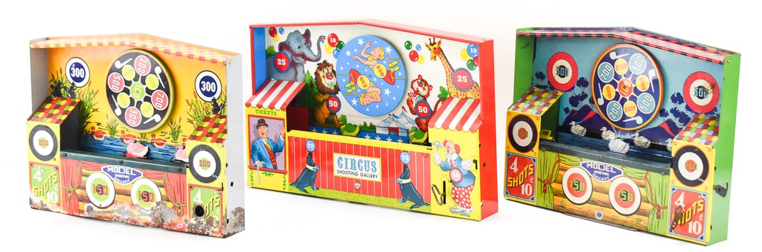 TRIO OF WIND UP TOY SHOOTING GALLERIES: This collection consists of three tin toy shooting galleries from the 1930s-1950s. Two of them are the Wyandotte Model Shooting Gallery which were manufactured by All Metal Products Co. The last one