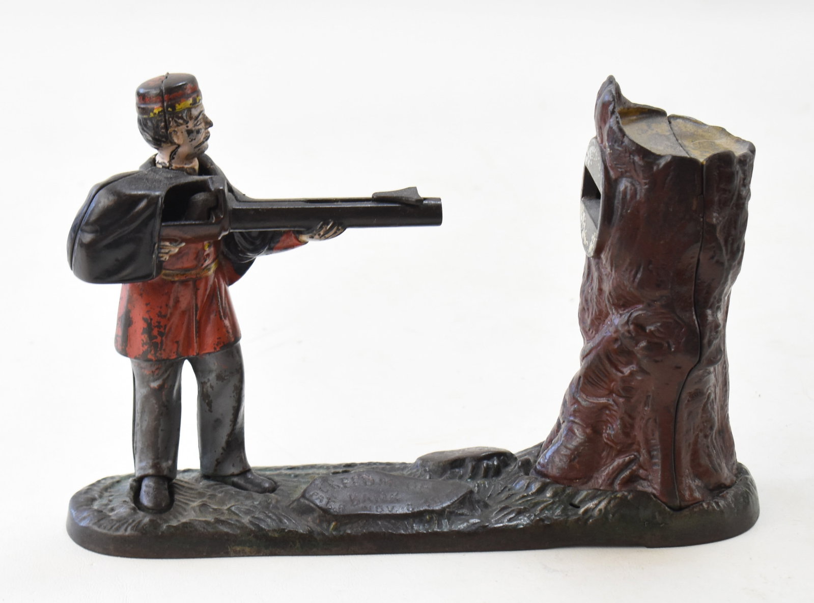 J. & E. STEVENS CREEDMOOR MECHANICAL BANK: The material of this bank is painted cast iron. It was designed by James H. Bowen and manufactured by J. & E. Stevens Co. in the late 19th century. The bank measures approx. 7" H x 10"