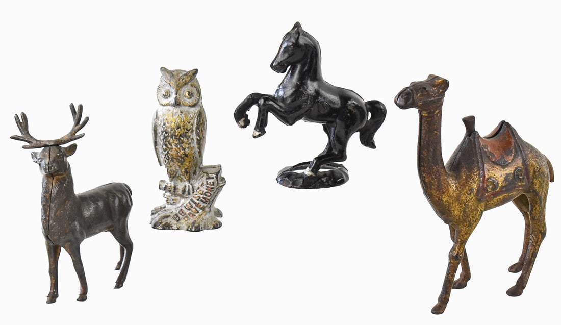 FOUR ANTIQUE CAST IRON STILL BANKS: A.C. WILLIAMS: An assortment of four cast iron still banks circa the early 20th century, including four cast iron still banks made by A. C. Williams including a "Be Wise, Save Money" owl still bank, a camel still ba