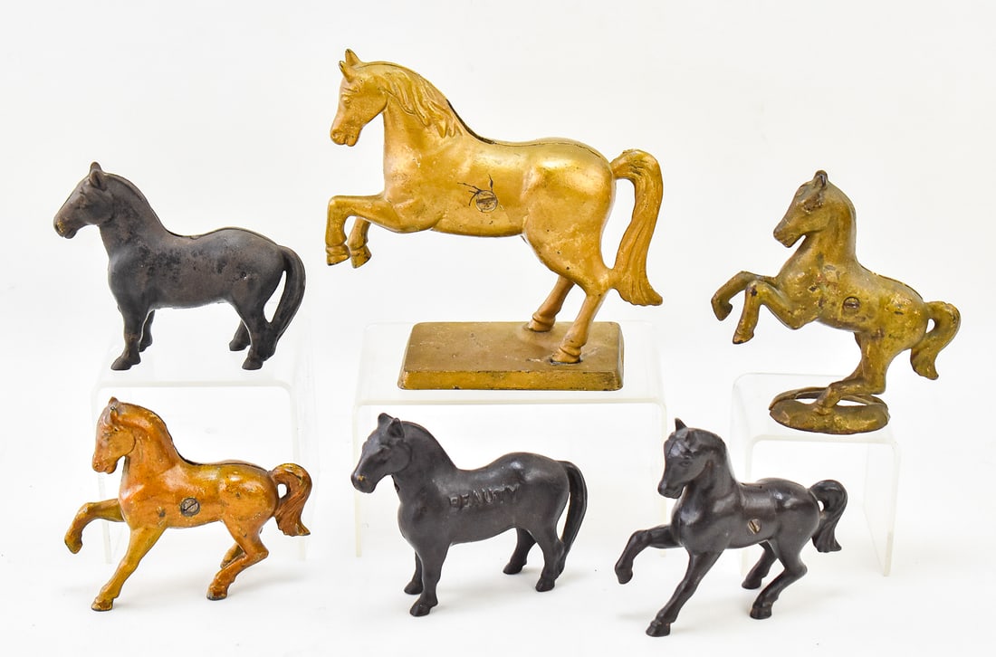 EARLY 20TH CENTURY HORSE COIN BANKS: A.C. WILLIAMS (ATTR.): This lot includes six horse coin banks with a few being attributed to A.C. Williams; one is marked "Beauty", circa early 20th century. The largest item measures approx. 6.5" H x 4.5" W x 3" D.