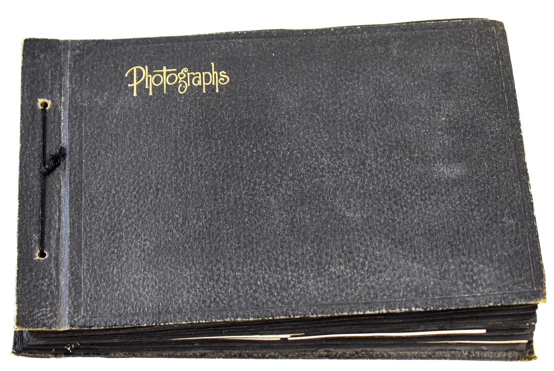 ANTIQUE FAMILY PHOTOGRAPH ALBUM: A circa late 1800s to early 1900s photograph album that depicts a families everyday life of farming, get togethers, military service, children and more. The album measures approx. 7.5" H x11.5" W x