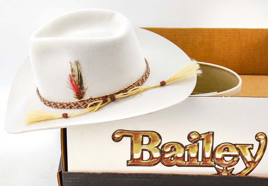VINTAGE BAILEY COWBOY HAT WITH BOX: A vintage Bailey light grey felt cowboy hat with the original box. Sized a 6 3/4. The box measures approx. 17" H x 15" W x 9" D.