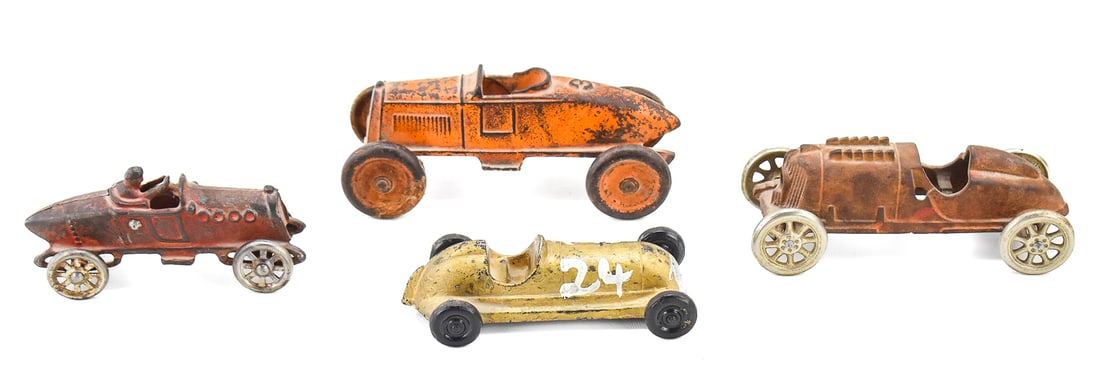 EARLY 20TH CENTURY CAST IRON AND ALUMINUM TOY CARS: REALISTIC TOY CO., KENTON, & MORE: This lot includes the following cast iron and aluminum toy cars, circa early 20th century: Realistic Toy Company boat-tail racer painted "24" circa 1946-1947, Kenton boat-tail racer "3" circa 1920-193