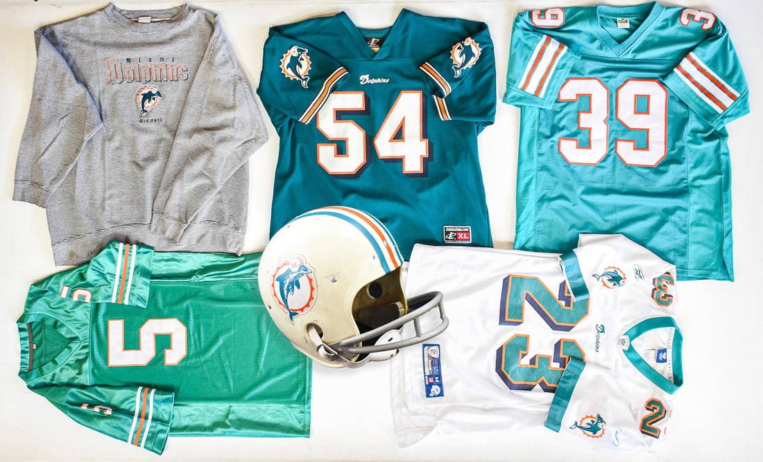 FIVE MIAMI DOLPHIN JERSEYS CSONKA, Z THOMAS & MORE: Five circa 1980s-1990s Miami Dolphin XL Jerseys which includes; #5 Finkle, #23 Brown, # 39 Csonka, and #54 Z.Thomas measuring approx 25" pit-pit and 33" back collar-hem. The lot also includes a youth