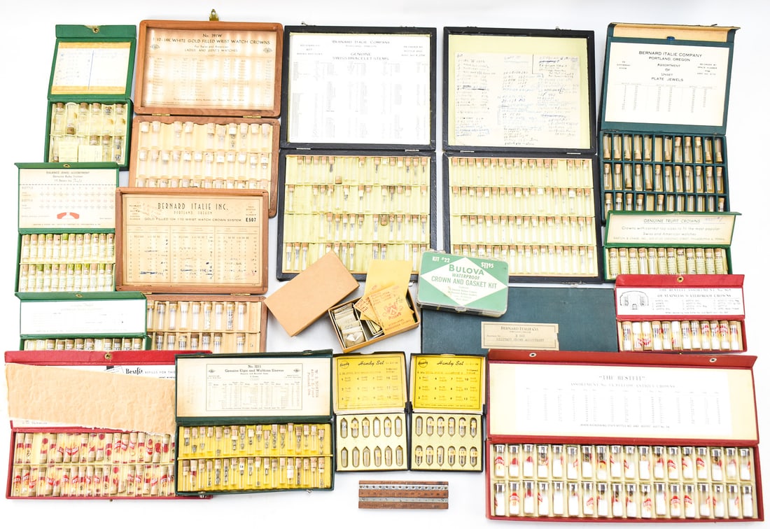 POCKET WATCH AND WRISTWATCH PARTS: CROWNS, SLEEVES, STEMS, BALANCE STAFFS: A large assortment or watch part sets for pocket watches and wristwatches including jewel screws, crowns, gaskets, sleeves, stems, balance staffs, and a "Coats" Jewel and Pivot Gauge, circa 1908. One